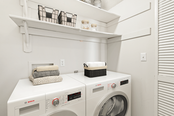 a laundry room with a washer and dryer at Eastchester Ridge Apartments, North Carolina